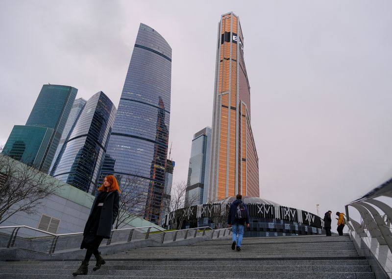 &copy; Reuters. People walk near the Moscow International Business Centre, also known as "Moskva-City", in Moscow, Russia November 12, 2019. REUTERS/Evgenia Novozhenina