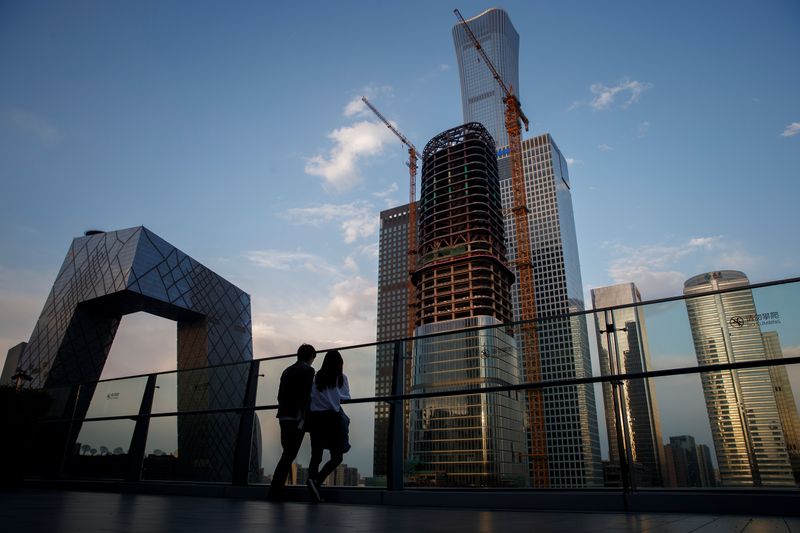 &copy; Reuters. People look at the skyline of the Central Business District in Beijing, China,  April 16, 2020.  REUTERS/Thomas Peter/Files