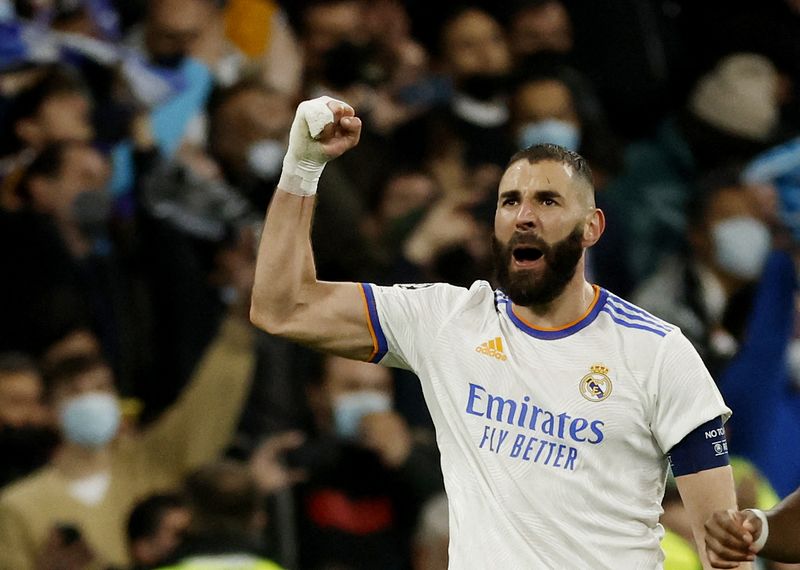 &copy; Reuters. Soccer Football - Champions League - Round of 16 Second Leg - Real Madrid v Paris St Germain - Santiago Bernabeu, Madrid, Spain - March 9, 2022 Real Madrid's Karim Benzema celebrates scoring their third goal REUTERS/Juan Medina