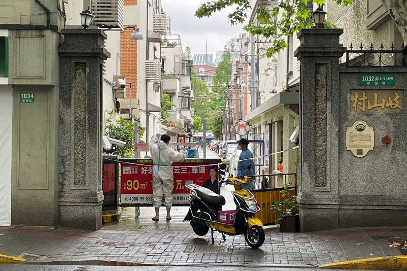 Shanghai fences up COVID-hit areas, fuelling fresh outcry