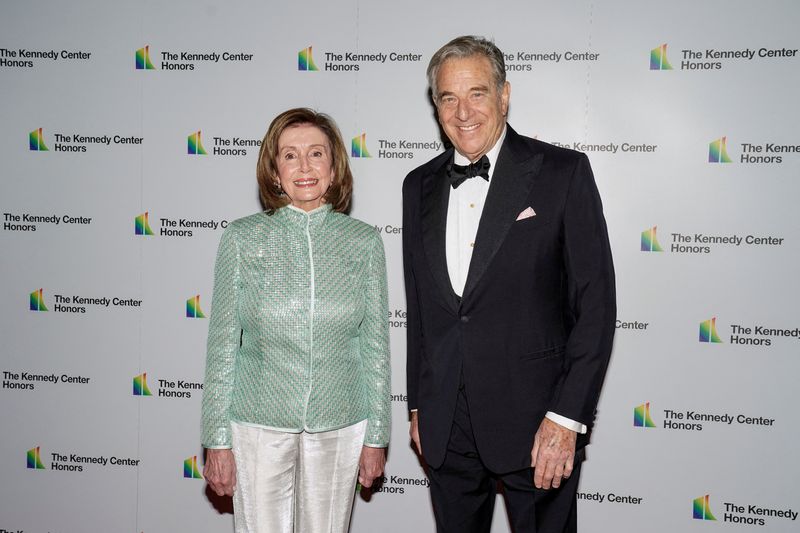 &copy; Reuters. FILE PHOTO: Speaker of the House Nancy Pelosi, D-CA and her husband Paul Pelosi arrive for the formal Artist's Dinner honoring the recipients of the 44th Annual Kennedy Center Honors at the Library of Congress in Washington, D.C., U.S., December 4, 2021. 