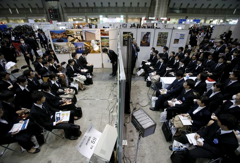 &copy; Reuters. FILE PHOTO: Job seekers attend orientation sessions at company booths during a job fair held for fresh graduates in Tokyo, Japan, March 20, 2016.   REUTERS/Yuya Shino