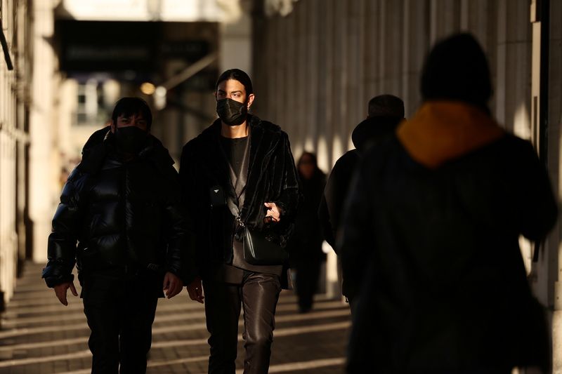 &copy; Reuters. FILE PHOTO: People, wearing protective face masks, walk below the arcades of the Rue de Rivoli in Paris, France, February 11, 2022. REUTERS/Sarah Meyssonnier