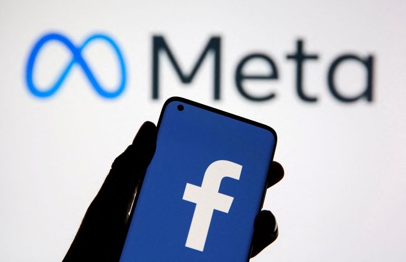 &copy; Reuters. FILE PHOTO: A smartphone with Facebook's logo is seen in front of displayed Facebook's new rebrand logo Meta in this illustration taken October 28, 2021. REUTERS/Dado Ruvic/Illustration//File Photo
