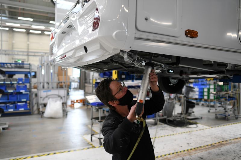 &copy; Reuters. FILE PHOTO: A worker assembles a vehicle at the Knaus-Tabbert AG factory in Jandelsbrunn near Passau, Germany, March 16, 2021. Picture taken March 16, 2021. REUTERS/Andreas Gebert/File Photo