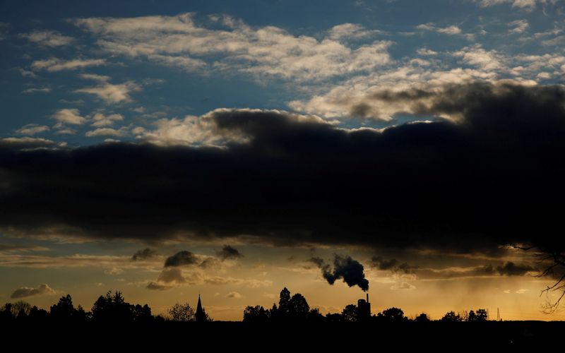 &copy; Reuters. FILE PHOTO: Smoke rises above a factory at sunset in Rugby, Britain February 10, 2021. REUTERS/Matthew Childs     TPX IMAGES OF THE DAY