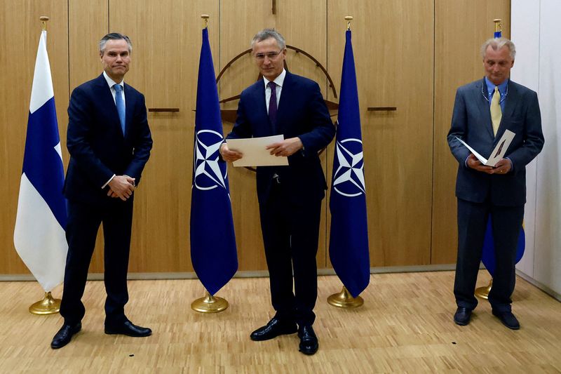 &copy; Reuters. FILE PHOTO: Finland's Ambassador to NATO Klaus Korhonen, NATO Secretary-General Jens Stoltenberg and Sweden's Ambassador to NATO Axel Wernhoff attend a ceremony to mark Sweden's and Finland's application for membership in Brussels, Belgium, May 18, 2022. 