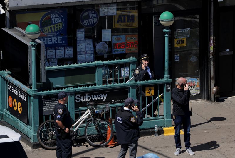 &copy; Reuters. FILE PHOTO: Law enforcement officers stand outside a subway station, the scene of a shooting, in the Brooklyn borough of New York City, New York, U.S., April 12, 2022. REUTERS/Andrew Kelly