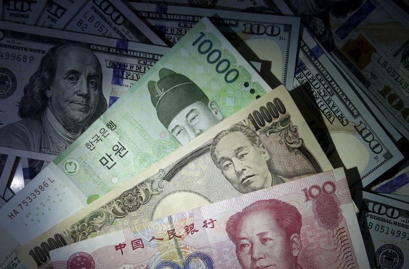 &copy; Reuters. South Korean won, Chinese yuan and Japanese yen notes are seen on U.S. 100 dollar notes in this picture illustration taken in Seoul, South Korea, December 15, 2015. REUTERS/Kim Hong-Ji