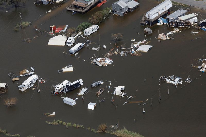 &copy; Reuters. FILE PHOTO: An aerial view shows destroyed houses in a flooded area after Hurricane Ida made landfall in Louisiana, in Montegut, Louisiana, U.S. August 31, 2021. REUTERS/Marco Bello