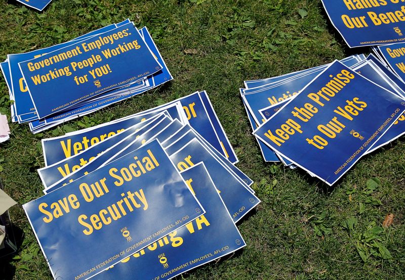 &copy; Reuters. FILE PHOTO: Signs are pictured on the ground during a noon-time rally of federal employees on Independence Mall to protest proposed cuts in federal funding in Philadelphia, Pennsylvania, U.S., June 22, 2017. REUTERS/Tom Mihalek/File Photo