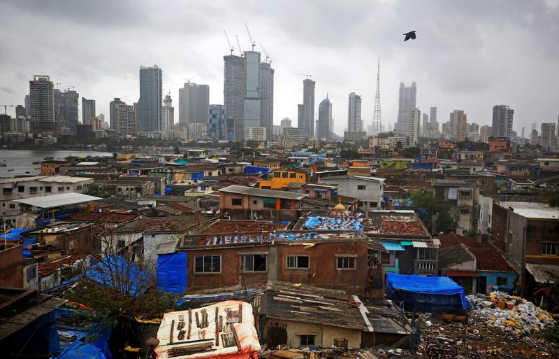 &copy; Reuters. FILE PHOTO: A bird flies across central Mumbai's financial district skyline, India, June 18, 2019. REUTERS/Francis Mascarenhas