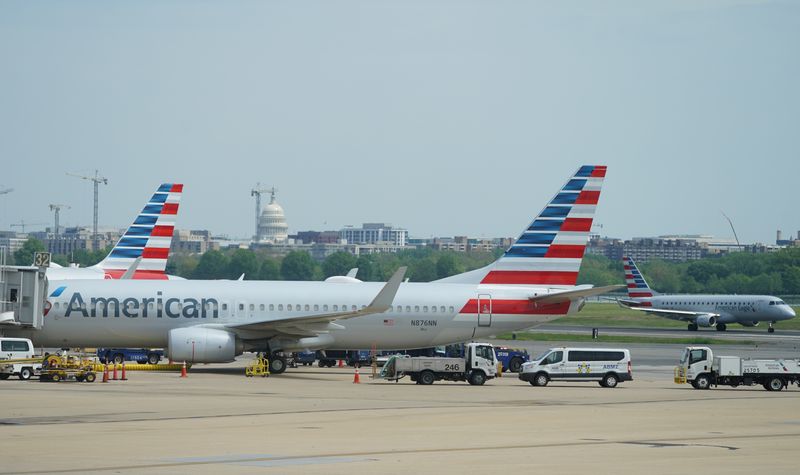 &copy; Reuters. FILE PHOTO: An American Airlines Boeing 737 jet sits at a gate at Washington's Reagan National airport with the U.S. Capitol building in the background as the novel coronavirus (COVID-19) pandemic continues to keep airline travel at minimal levels and the