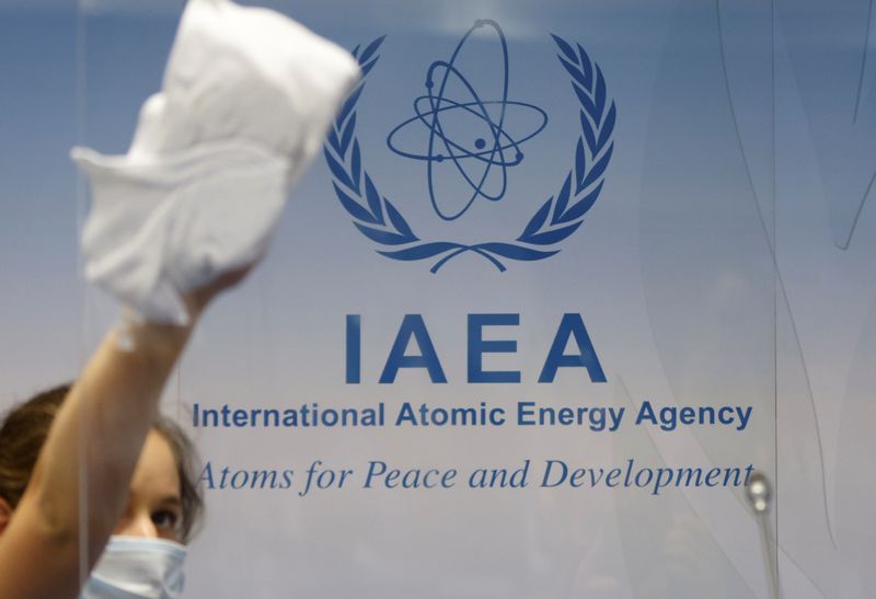 &copy; Reuters. FILE PHOTO: A cleaning staff works before a news conference attended by IAEA Director General Rafael Grossi during an IAEA Board of Governors meeting in Vienna, Austria, September 13, 2021.  REUTERS/Leonhard Foeger