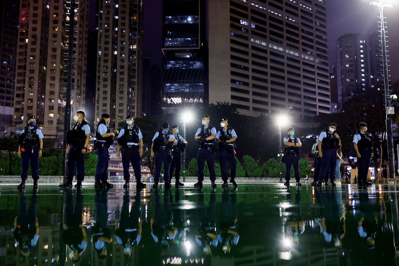 &copy; Reuters. Police officers stand guard after announcing a closure of a part of Victoria Park, where the candlelight vigil used to be held, a day a head of the 33rd anniversary of the crackdown on pro-democracy demonstrations at Beijing's Tiananmen Square, in Hong Ko