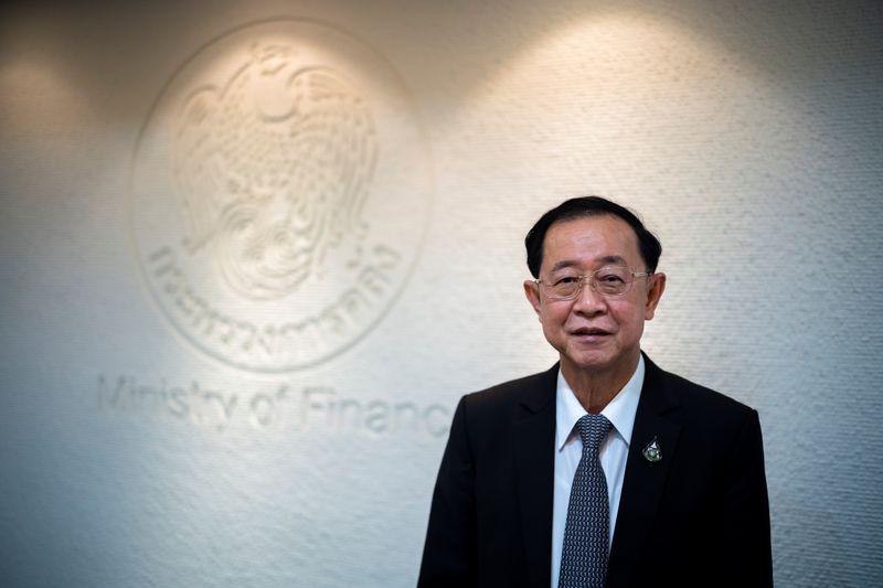 &copy; Reuters. FILE PHOTO: Thai finance minister Arkhom Termpittayapaisith poses before an interview with Reuters in Bangkok, Thailand, REUTERS/Athit Perawongmetha