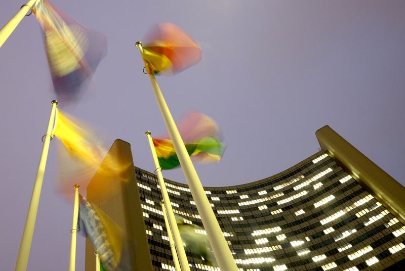 &copy; Reuters. Flags flutter in the wind in front of the headquarters of the International Atomic Energy Agency (IAEA) in Vienna, Austria, December 16, 2020. REUTERS/Lisi Niesner