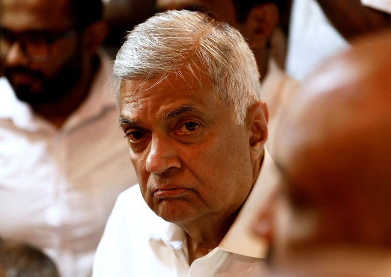 &copy; Reuters. FILE PHOTO: Ranil Wickremesinghe, newly appointed prime minister, arrives at a Buddhist temple after his swearing-in ceremony amid the country's economic crisis, in Colombo, Sri Lanka, May 12, 2022. REUTERS/Dinuka Liyanawatte