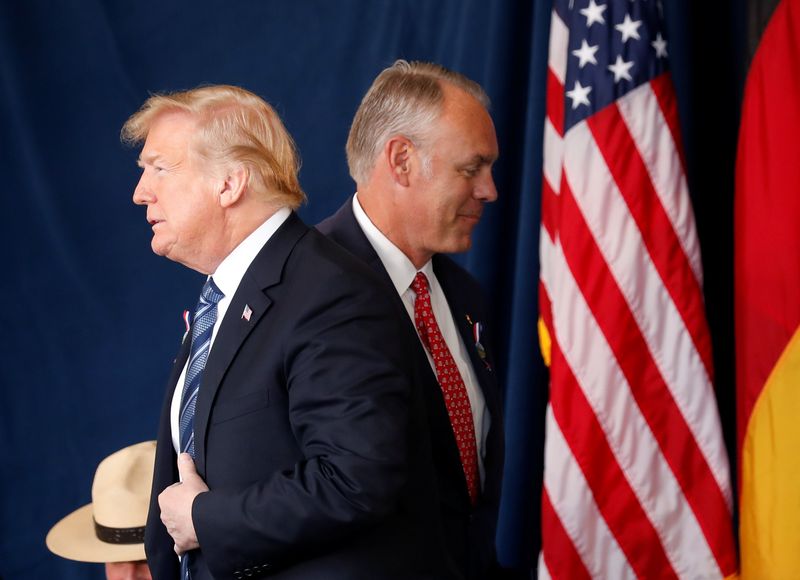 &copy; Reuters. FILE PHOTO: U.S. President Donald Trump walks past Interior Secretary Ryan Zinke as he stands to address the 17th annual September 11 observance at the Flight 93 National Memorial near Shanksville, Pennsylvania, U.S., September 11, 2018. REUTERS/Kevin Lam