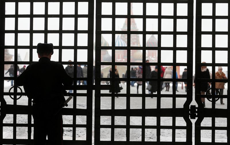 &copy; Reuters. FILE PHOTO: An Interior Ministry officer closes the gate, with Red Square and St. Basil's Cathedral seen in the background, in central Moscow, Russia, November 10, 2016. REUTERS/Maxim Zmeyev