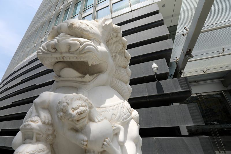 &copy; Reuters. FILE PHOTO: A surveillance camera is seen near a lion statue outside a bank on the Financial Street in Beijing, China July 9, 2021. REUTERS/Tingshu Wang