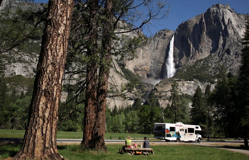 &copy; Reuters. FILE PHOTO: A family has a picnic in view of Upper Yosemite Falls in Yosemite National Park, California May 17, 2009. REUTERS/Robert Galbraith