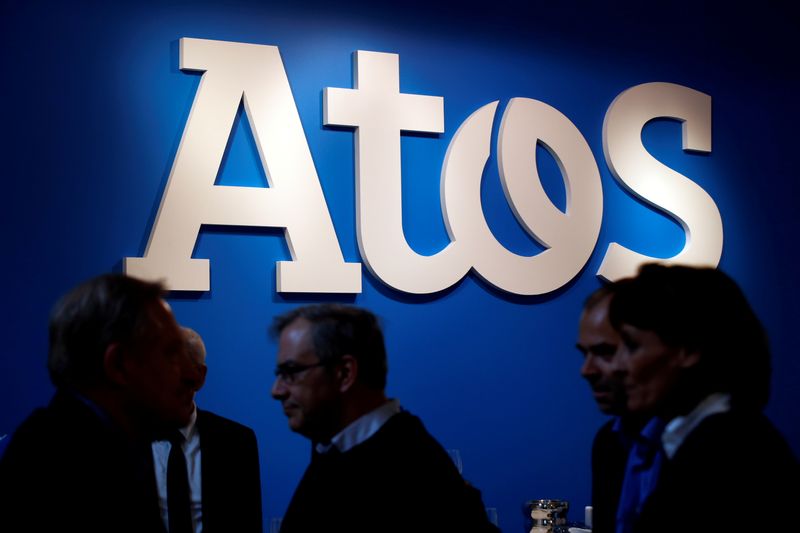 &copy; Reuters. FILE PHOTO: People walk in front of Atos company's logo during a presentation of the new Bull sequana supercomputer in Paris, France, April 12, 2016. REUTERS/Philippe Wojazer