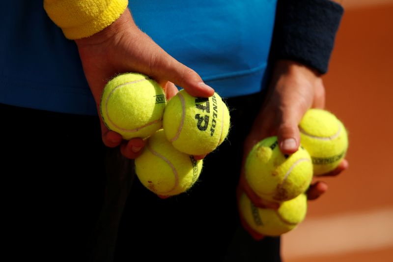 &copy; Reuters. FILE PHOTO: Tennis - ATP Masters 1000 - Italian Open - Foro Italico, Rome, Italy - September 15, 2020   A ball boy holding tennis balls   Pool via REUTERS/Clive Brunskill