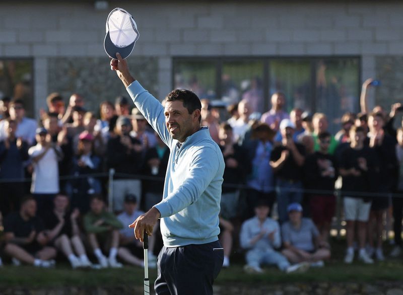 &copy; Reuters. June 11, 2022; St. Albans, UK;  Charl Schwartzel celebrates after winning the inaugural LIV golf invitational golf tournament at the Centurion Club. Mandatory Credit: Paul Childs-Action Images/Reuters via USA TODAY Sports