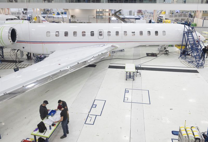 &copy; Reuters. FILE PHOTO: Bombardier employees work on interior completions and exterior touch-ups for delivery preparation of the Global aircraft at Bombardier's Laurent Beaudoin Completion Centre in Montreal, Quebec, Canada March 29, 2022.  REUTERS/Christinne Muschi/