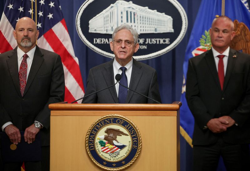 © Reuters. United States Attorney General Merrick Garland is joined by U.S. Attorney for the Northern District of Texas Chad Meacham and Jeff Boshek, Special Agent in Charge of the ATF’s Dallas Field Division, during a press conference announcing a significant firearms trafficking enforcement action and ongoing efforts to protect communities from violent crime and gun violence at the Department of Justice in Washington, U.S., June 13, 2022. REUTERS/Evelyn Hockstein