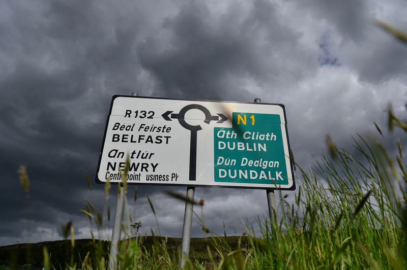 &copy; Reuters. FILE PHOTO: A road sign at a roundabout on the border between Northern Ireland and Ireland with directions to Belfast and Dublin is seen in Carrickcarnan, Ireland, May 19, 2022. REUTERS/Clodagh Kilcoyne/File Photo