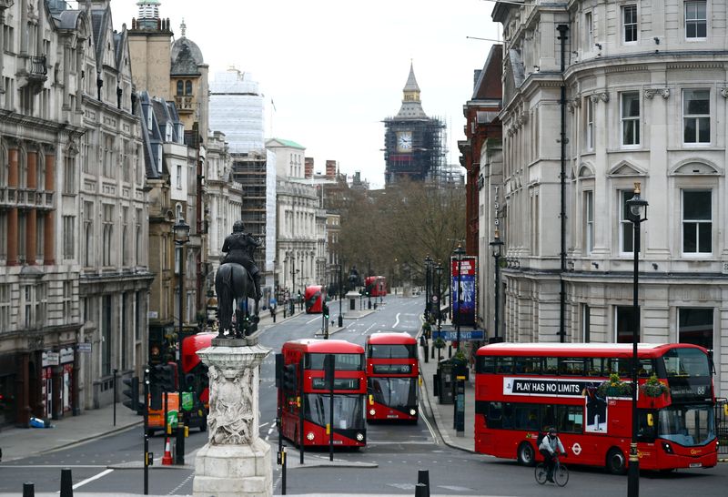 &copy; Reuters. FILE PHOTO: London buses travel along Whitehall in Westminster in London, Britain, April 2, 2021. REUTERS/Hannah McKay