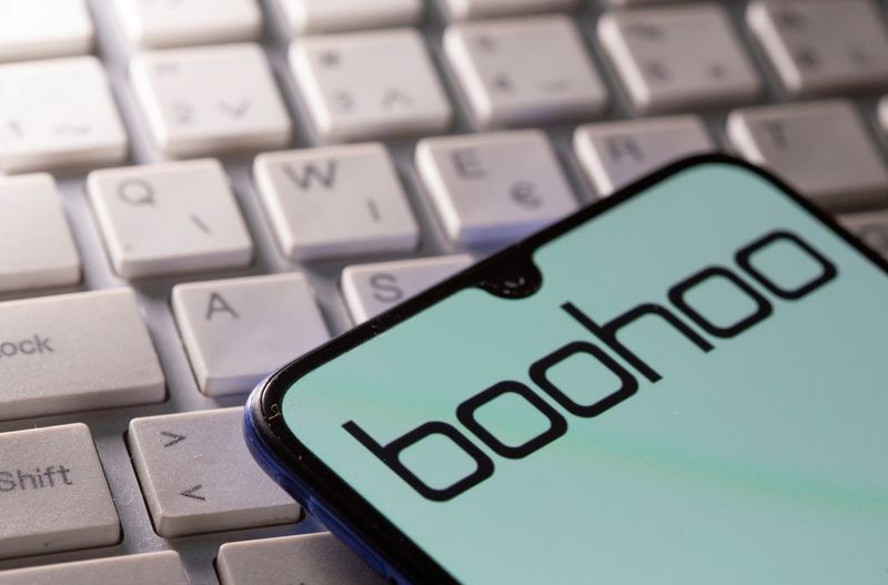 &copy; Reuters. FILE PHOTO: A smartphone with the Boohoo logo displayed is seen on a keyboard in this illustration taken September 30, 2020. REUTERS/Dado Ruvic/Illustration