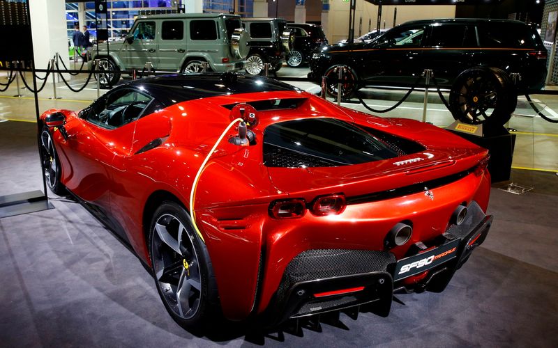 &copy; Reuters. FILE PHOTO: A charging cable is plugged into a Ferrari SF90 Stradale hybrid sports car during a media preview at the Auto Zurich Car Show in Zurich, Switzerland November 3, 2021. REUTERS/Arnd Wiegmann/File Photo