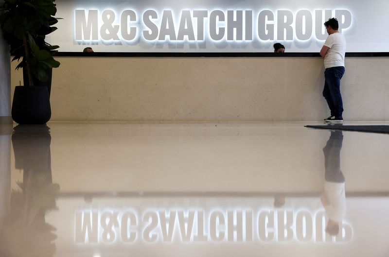 &copy; Reuters. FILE PHOTO: A person stands in the reception of the M&C Saatchi office in central London, Britain, January 6, 2022. REUTERS/Henry Nicholls