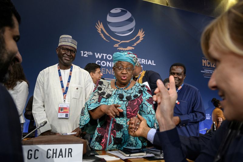 &copy; Reuters. World Trade Organization Director-General Ngozi Okonjo-Iweala reacts while talking with delegates after a closing session of a World Trade Organization Ministerial Conference at the WTO headquarters in Geneva, Switzerland June 17, 2022. Fabrice Coffrini/P
