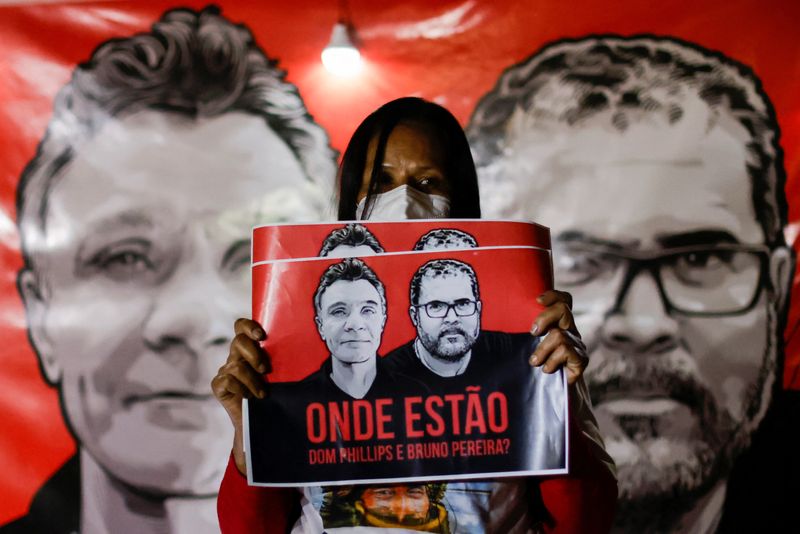 &copy; Reuters. A demonstrator holds a sign during a protest against Brazilian President Jair Bolsonaro's government, Brazil's National Indian Foundation (FUNAI)'s President Marcelo Augusto Xavier da Silva and for the search for British journalist Dom Phillips and indige