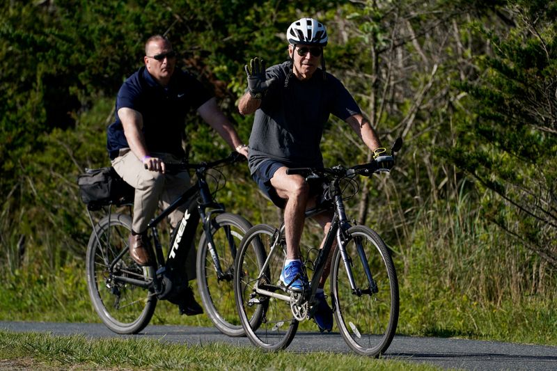 Biden gets off the bike, falls, but unharmed
