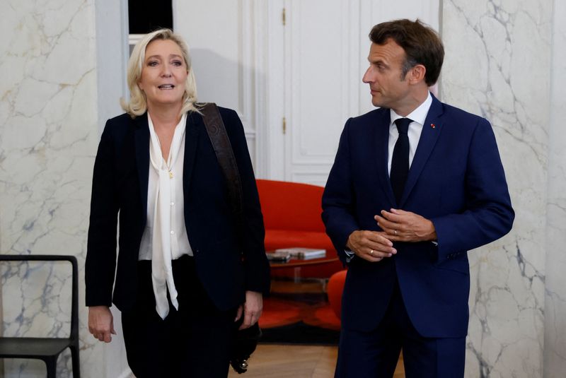 &copy; Reuters. FILE PHOTO: French far-right Rassemblement National (RN) leader and Member of Parliament Marine Le Pen is escorted by France's President Emmanuel Macron after talks at the presidential Elysee Palace, France, June 21, 2022. Ludovic Marin/Pool via REUTERS