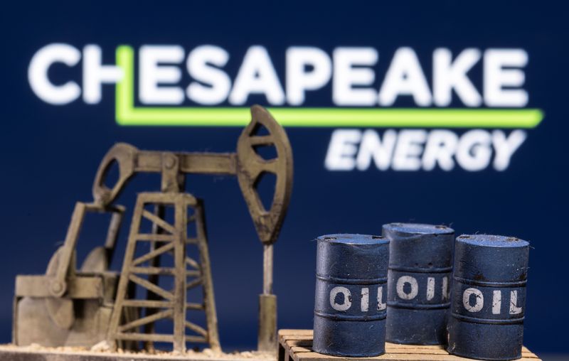 &copy; Reuters. FILE PHOTO: A 3D printed oil barrels and oil pump jack are seen in front of displayed Chesapeake Energy logo in this illustration taken January 25, 2022. REUTERS/Dado Ruvic/Illustration