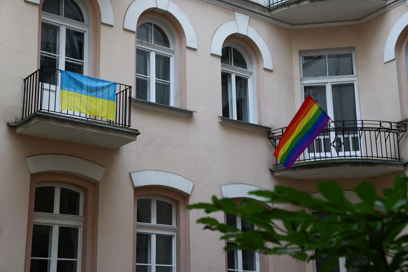 &copy; Reuters. The Ukrainian flag and LGBT+ Rainbow flag are pictured on the balcony of the Polish gay rights organisation Campaign Against Homophobia office in Warsaw, Poland June 24, 2022. Picture taken June 24, 2022. REUTERS/Kuba Stezycki