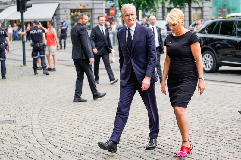 &copy; Reuters. Norwegian Prime Minister Jonas Gahr Store and Church Council leader Kristin Gunleiksrud Raaum arrive to attend the mourning service at Oslo Cathedral, after a shooting at the London Pub, in Oslo, Norway, June 26, 2022. Javad Parsa/NTB/via REUTERS