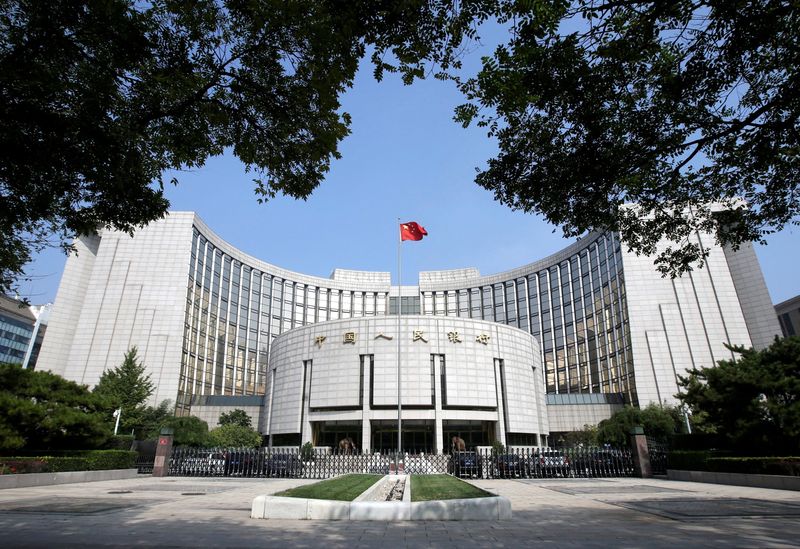 &copy; Reuters. FILE PHOTO: Headquarters of the People's Bank of China (PBOC), the central bank, is pictured in Beijing, China September 28, 2018. REUTERS/Jason Lee/File Photo