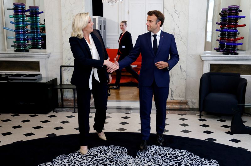 &copy; Reuters. FILE PHOTO: French far-right Rassemblement National (RN) leader and Member of Parliament Marine Le Pen is escorted by France's President Emmanuel Macron after talks at the presidential Elysee Palace, France, June 21, 2022. Ludovic Marin/Pool via REUTERS