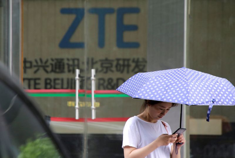 &copy; Reuters. A woman stands outside a building of ZTE Beijing research and development center in Beijing, China June 13, 2018. REUTERS/Jason Lee