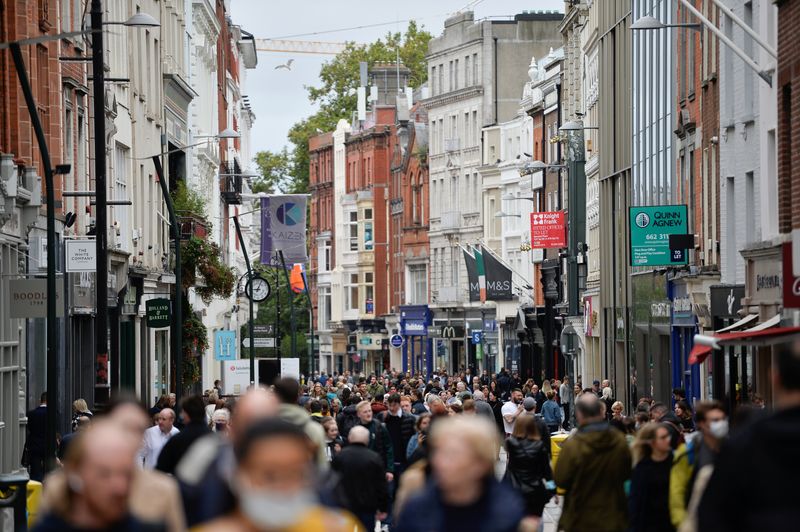 &copy; Reuters. FILE PHOTO: People walk in a busy retail street, after Ireland's Minister for Finance Paschal Donohoe presented the Budget 2022, in Dublin, Ireland, October 12, 2021. REUTERS/Clodagh Kilcoyne