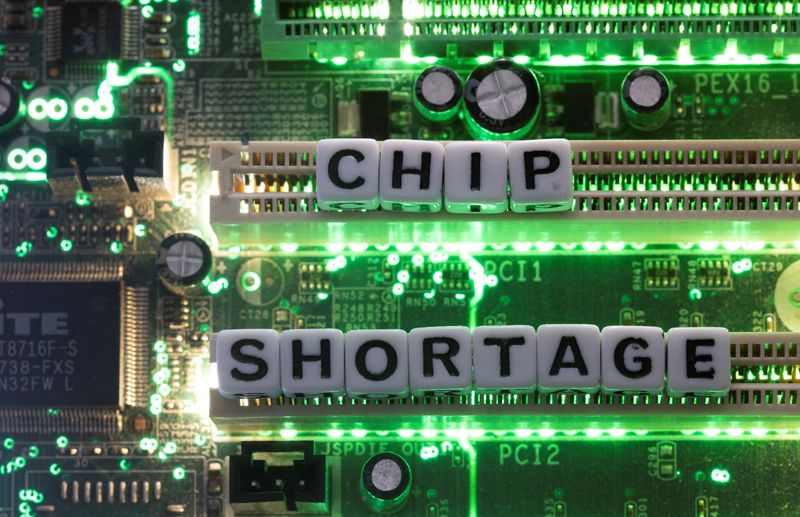 &copy; Reuters. Plastic letters arranged to read "Chip Shortage" are placed on a computer motherboard in this illustration taken, February 20, 2022. REUTERS/Dado Ruvic/Illustration
