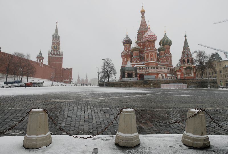 &copy; Reuters. FILE PHOTO: The clock on Spasskaya tower showing the time at noon, is pictured next to Moscow?s Kremlin, and St. Basil?s Cathedral, March 31, 2020. REUTERS/Maxim Shemetov