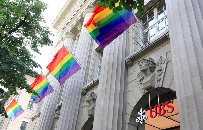 &copy; Reuters. FILE PHOTO: Rainbow flags fly over the entrance of the headquarters of Swiss bank UBS on the occasion of Pride Month in Zurich, Switzerland June 18, 2021. REUTERS/Arnd WIegmann